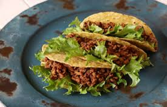 multiple tacos with meet and lettuce