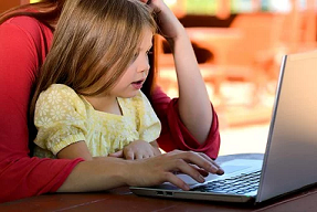 Child and Parent on Computer